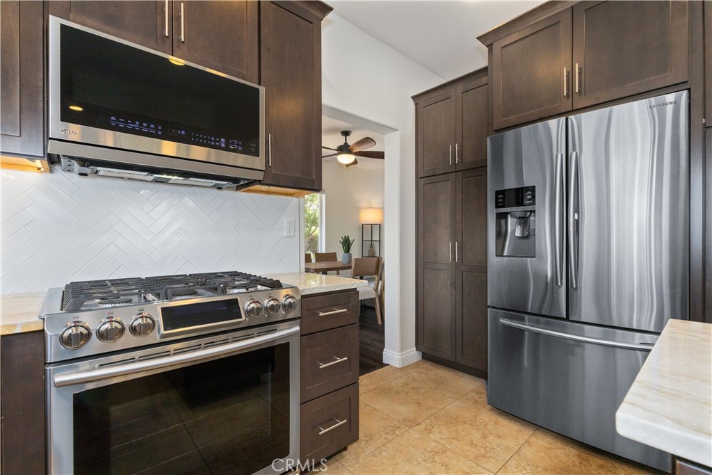 142 Via Camelia Paso Robles, CA 93446 - Photo 9 of 43 a kitchen with a stove microwave and refrigerator