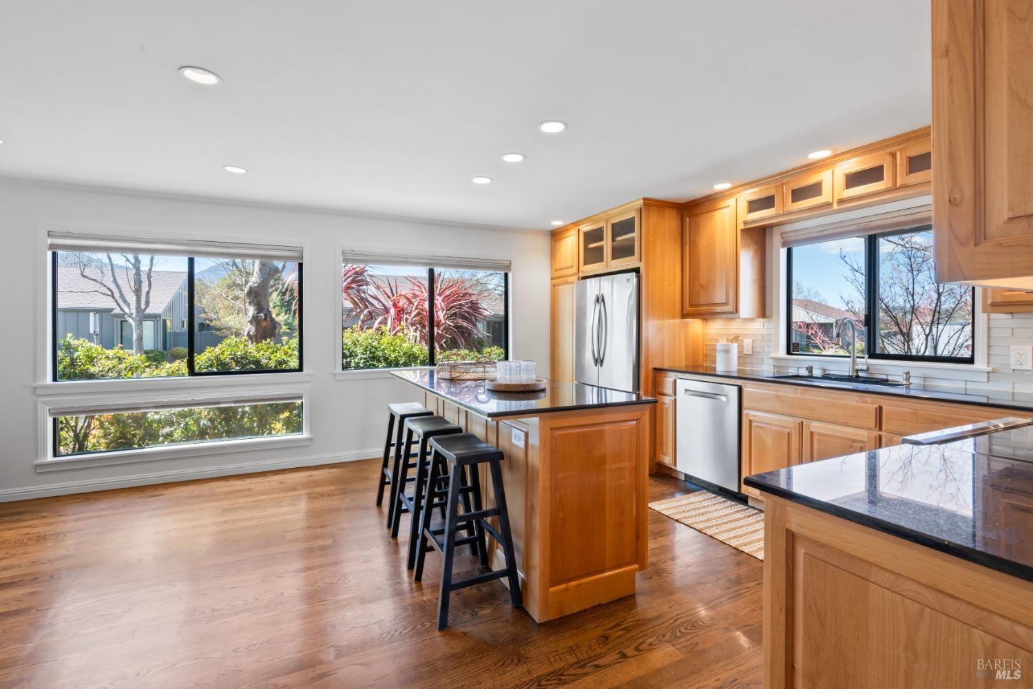 74 Sandpiper Circle Corte Madera, CA 94925 - Photo 1 of 1 a dining room with furniture a painting and wooden floor