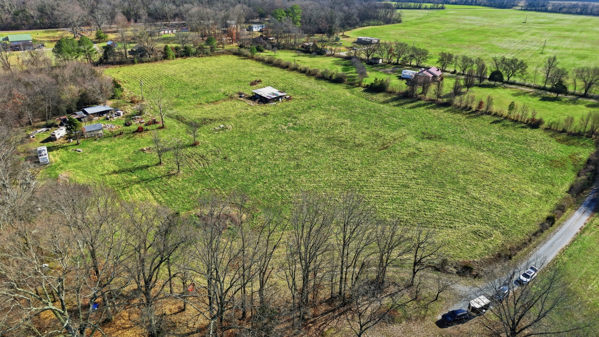 640 Dotson Cemetery Road Decherd, TN 37324 - Photo 9 of 18 a view of a garden with a building in the background