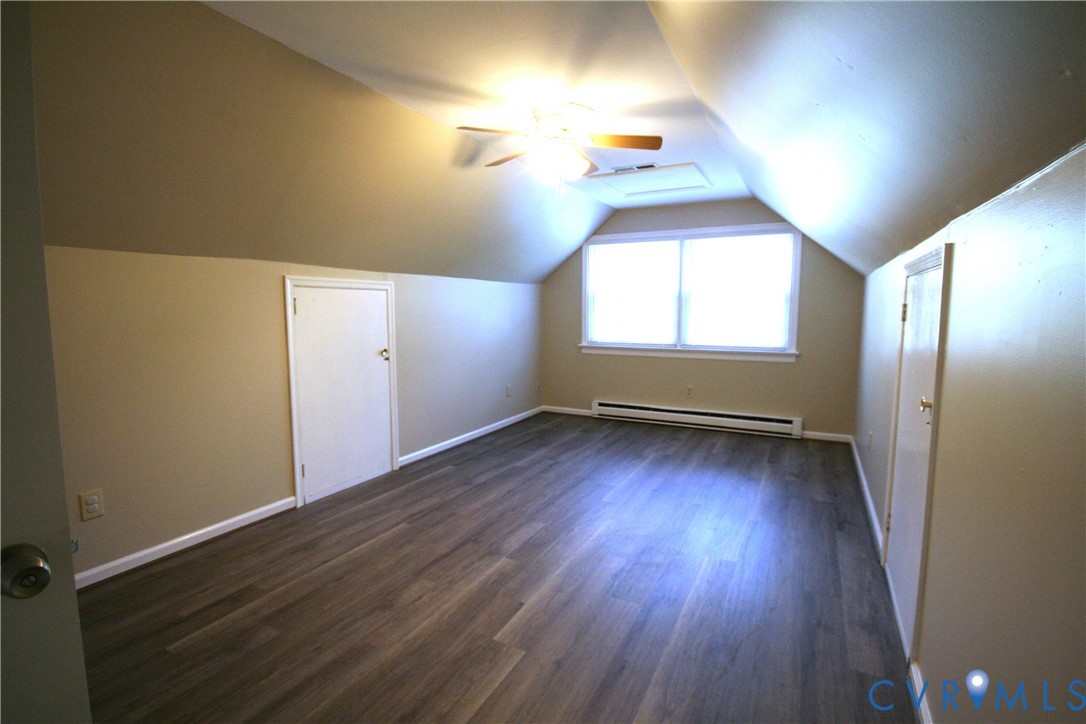 12141 Old Buckingham Road Midlothian, VA 23113 - Photo 18 of 39 Attic room featuring wood-finish flooring, an angl