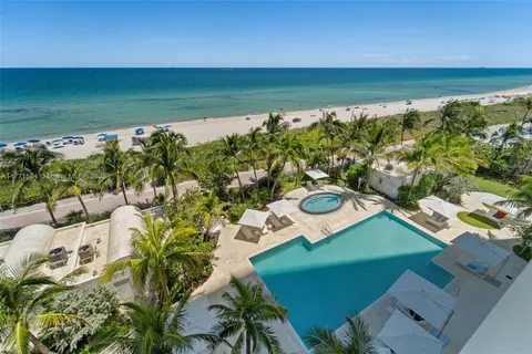 a view of a swimming pool and lounge chair