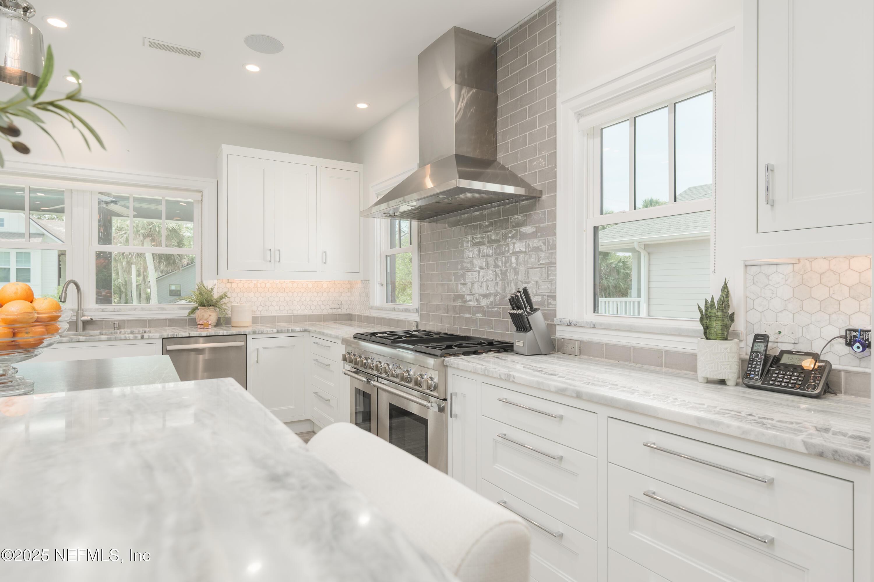 365 8th Street Atlantic Beach, FL 32233 - Photo 12 of 65 a kitchen with granite countertop a sink stainless steel appliances and cabinets