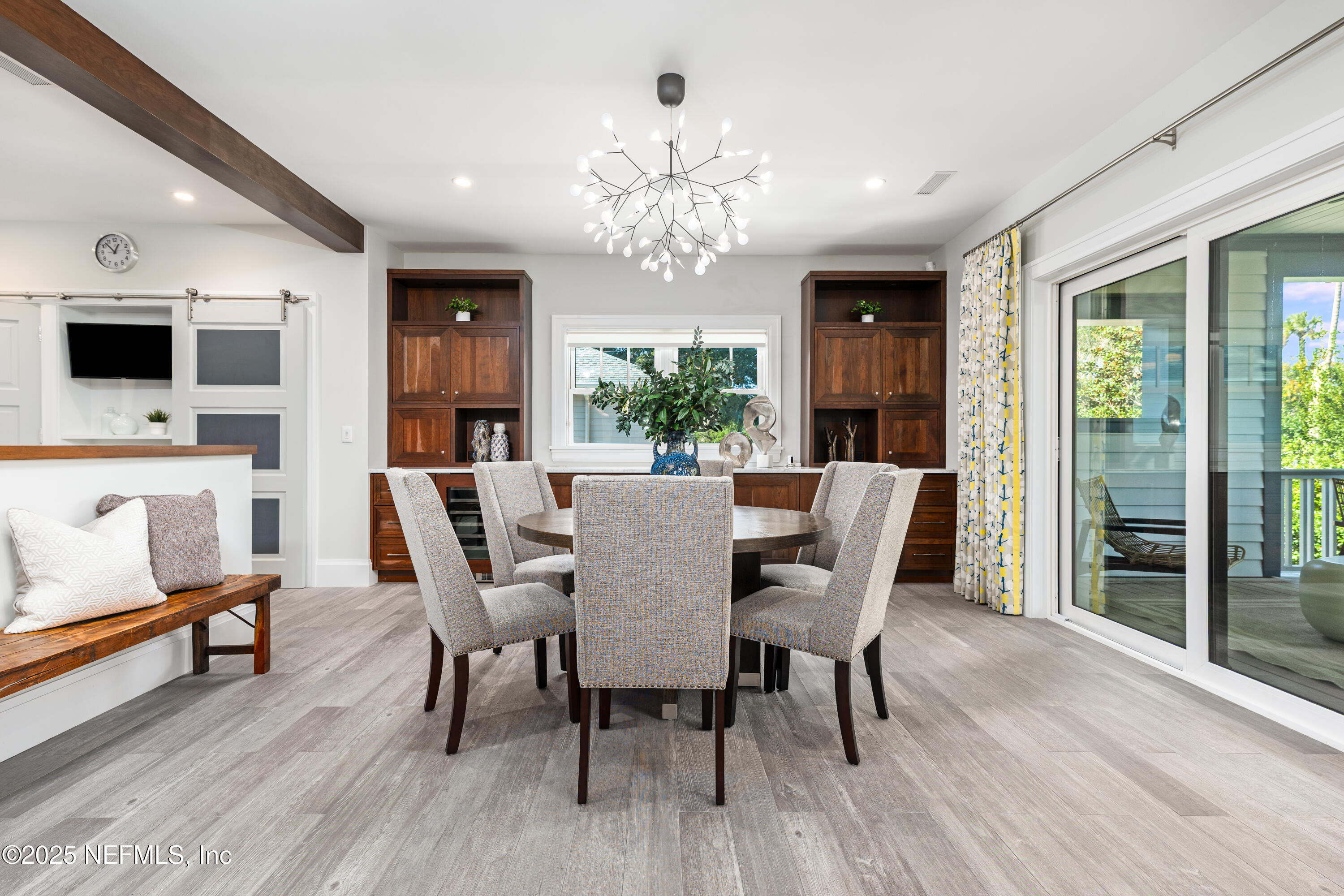 365 8th Street Atlantic Beach, FL 32233 - Photo 18 of 65 a view of a dining room with furniture window and wooden floor