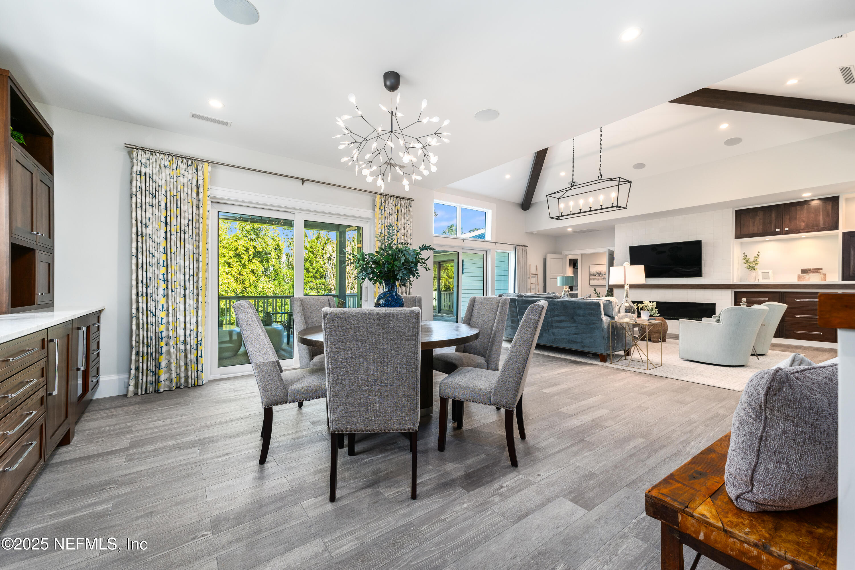 365 8th Street Atlantic Beach, FL 32233 - Photo 19 of 65 a view of a dining room with furniture a chandelier and wooden floor