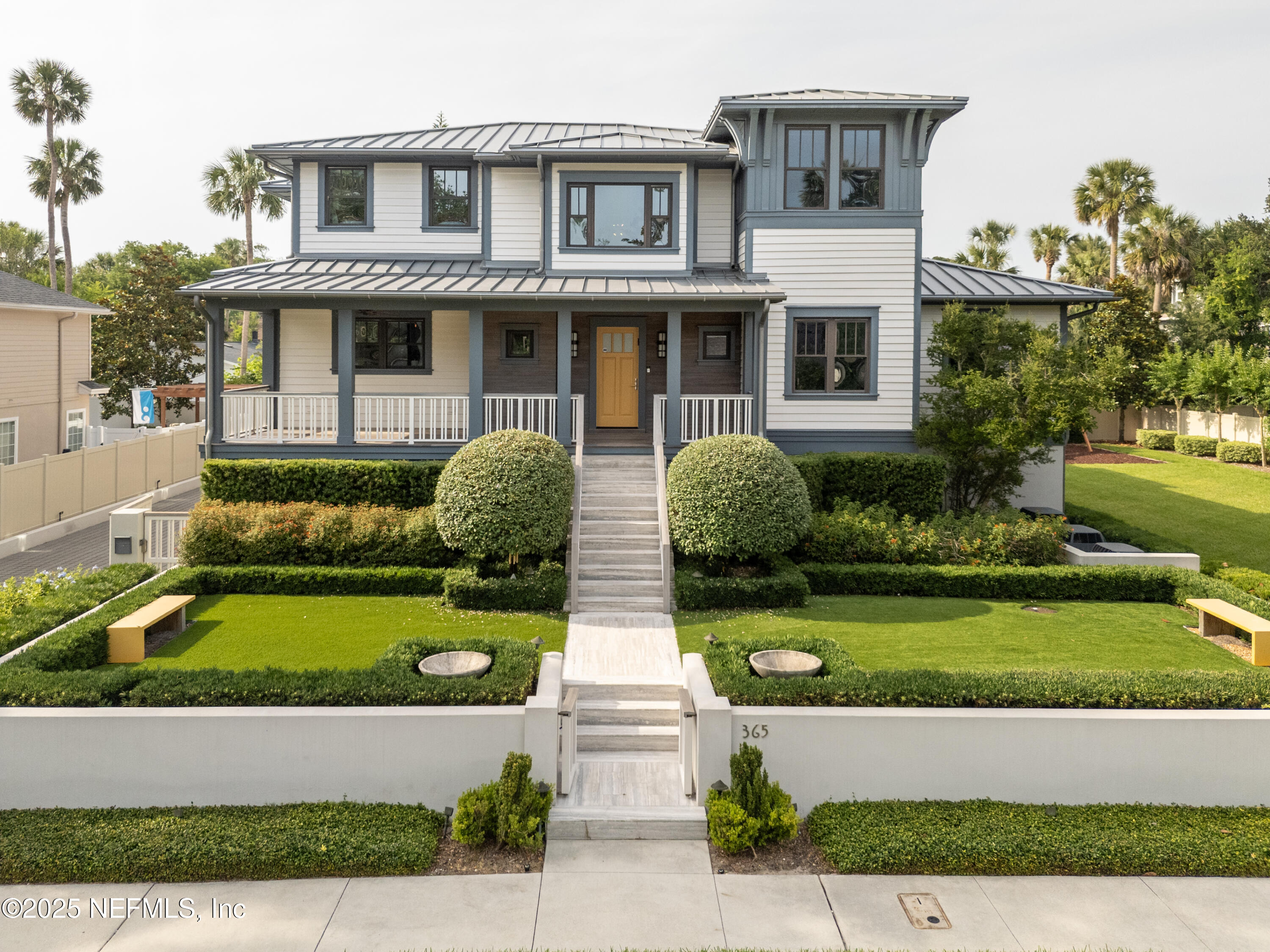 365 8th Street Atlantic Beach, FL 32233 - Photo 2 of 65 a front view of a house with garden