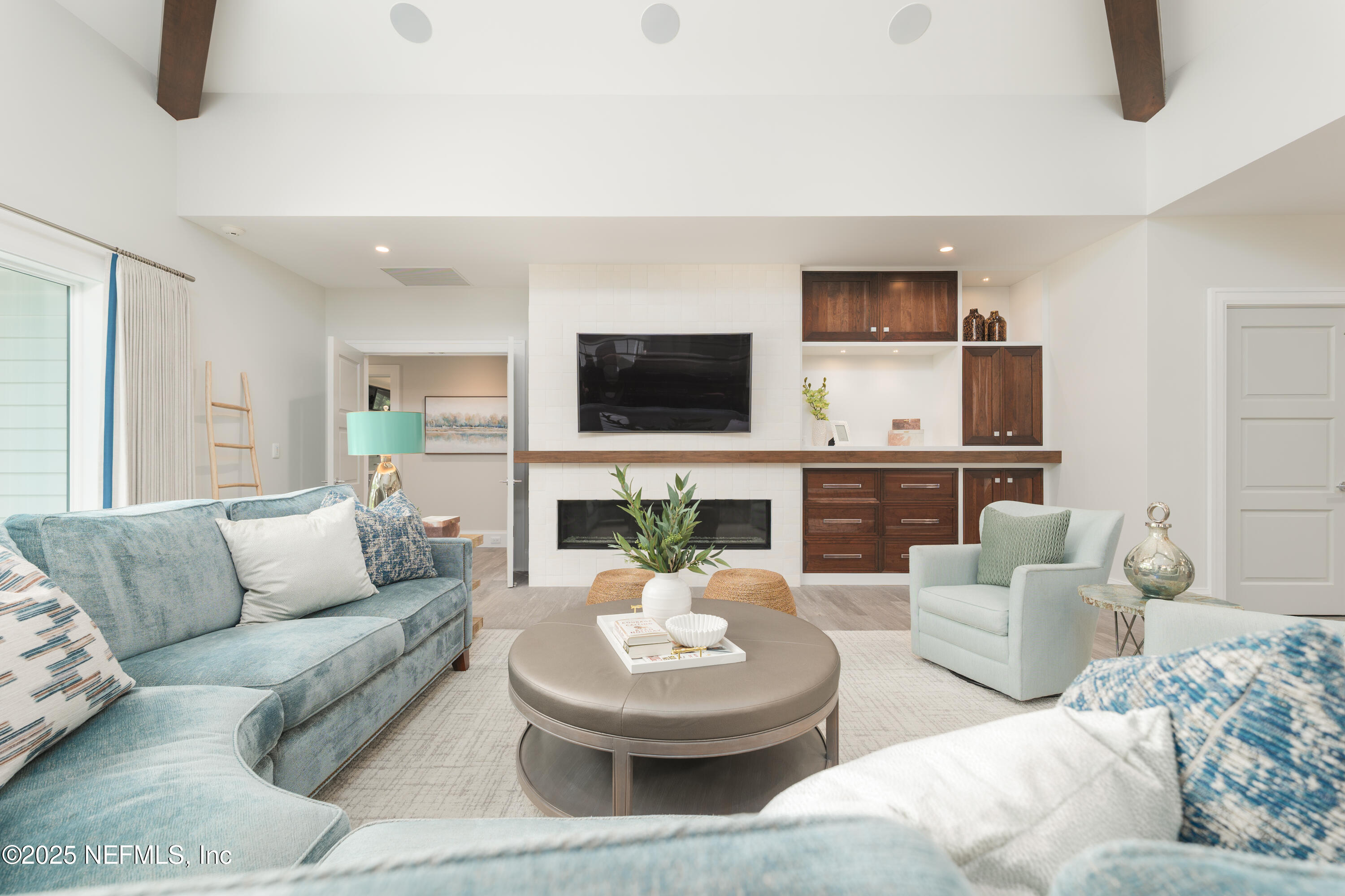 365 8th Street Atlantic Beach, FL 32233 - Photo 21 of 65 a living room with furniture a fireplace and a flat screen tv