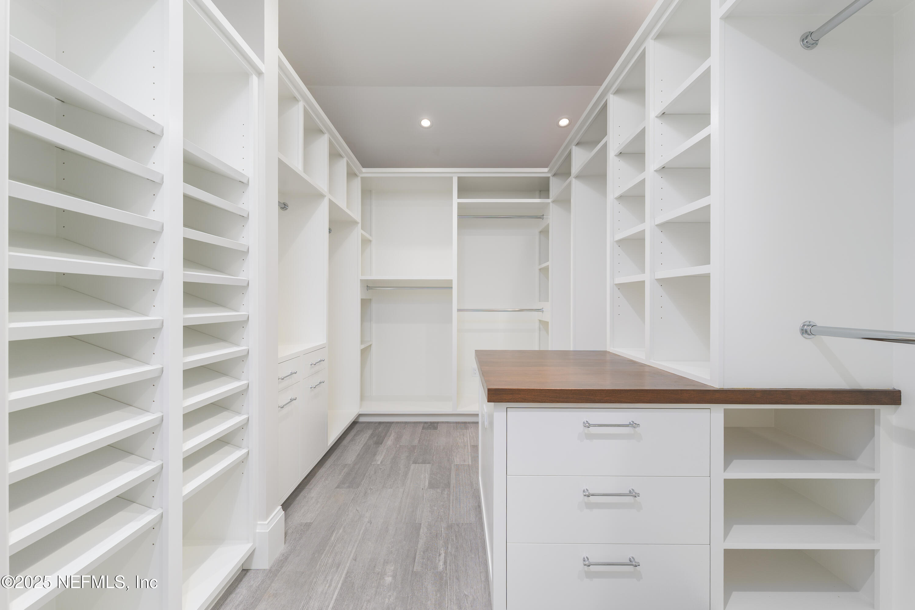 365 8th Street Atlantic Beach, FL 32233 - Photo 28 of 65 a view of walk in closet with empty racks