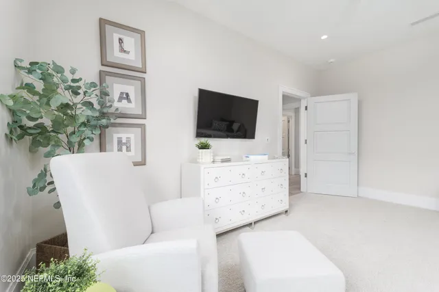 a view of kitchen with furniture and wooden floor