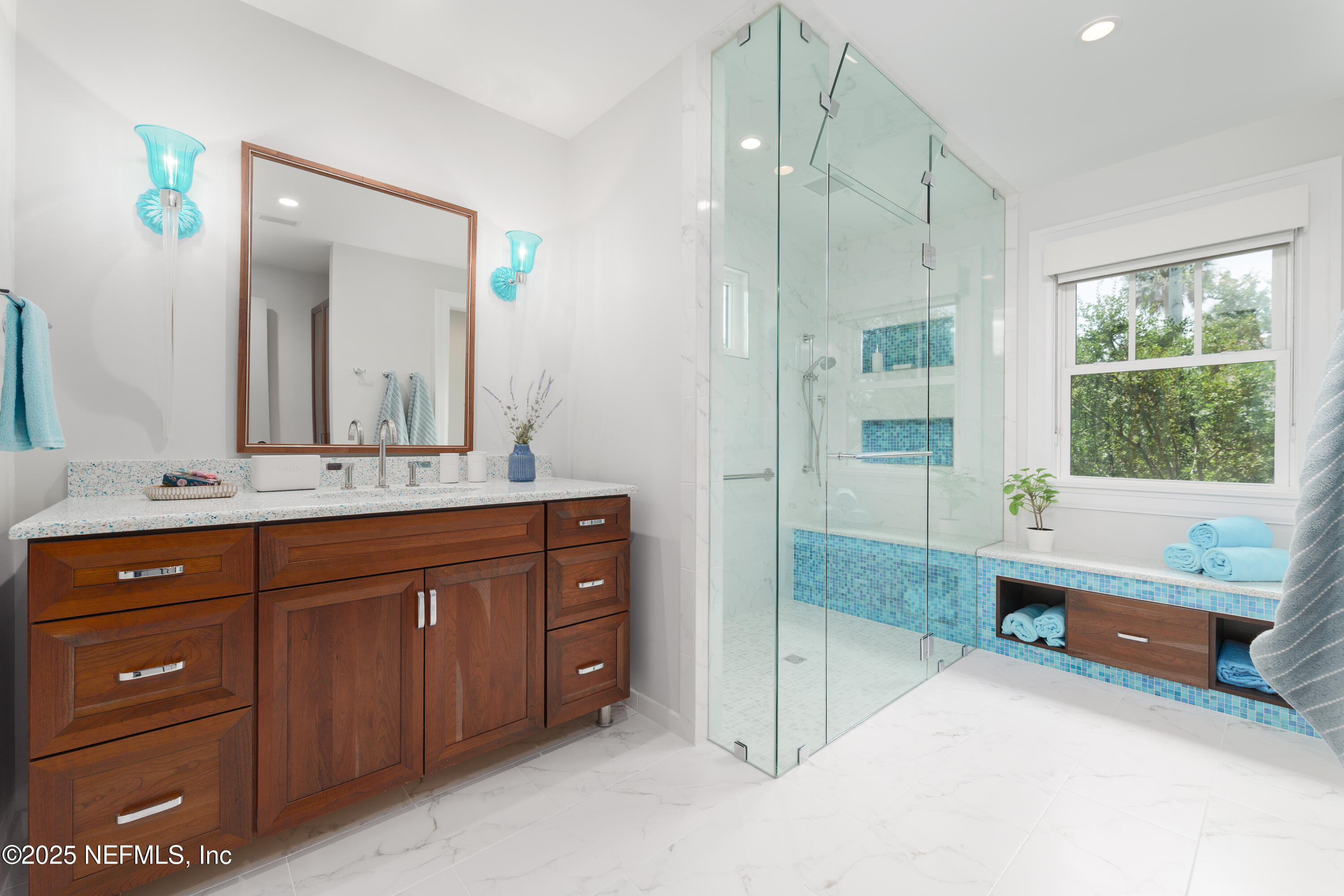 365 8th Street Atlantic Beach, FL 32233 - Photo 32 of 65 a spacious bathroom with a granite countertop tub sink a mirror a vanity and a shower