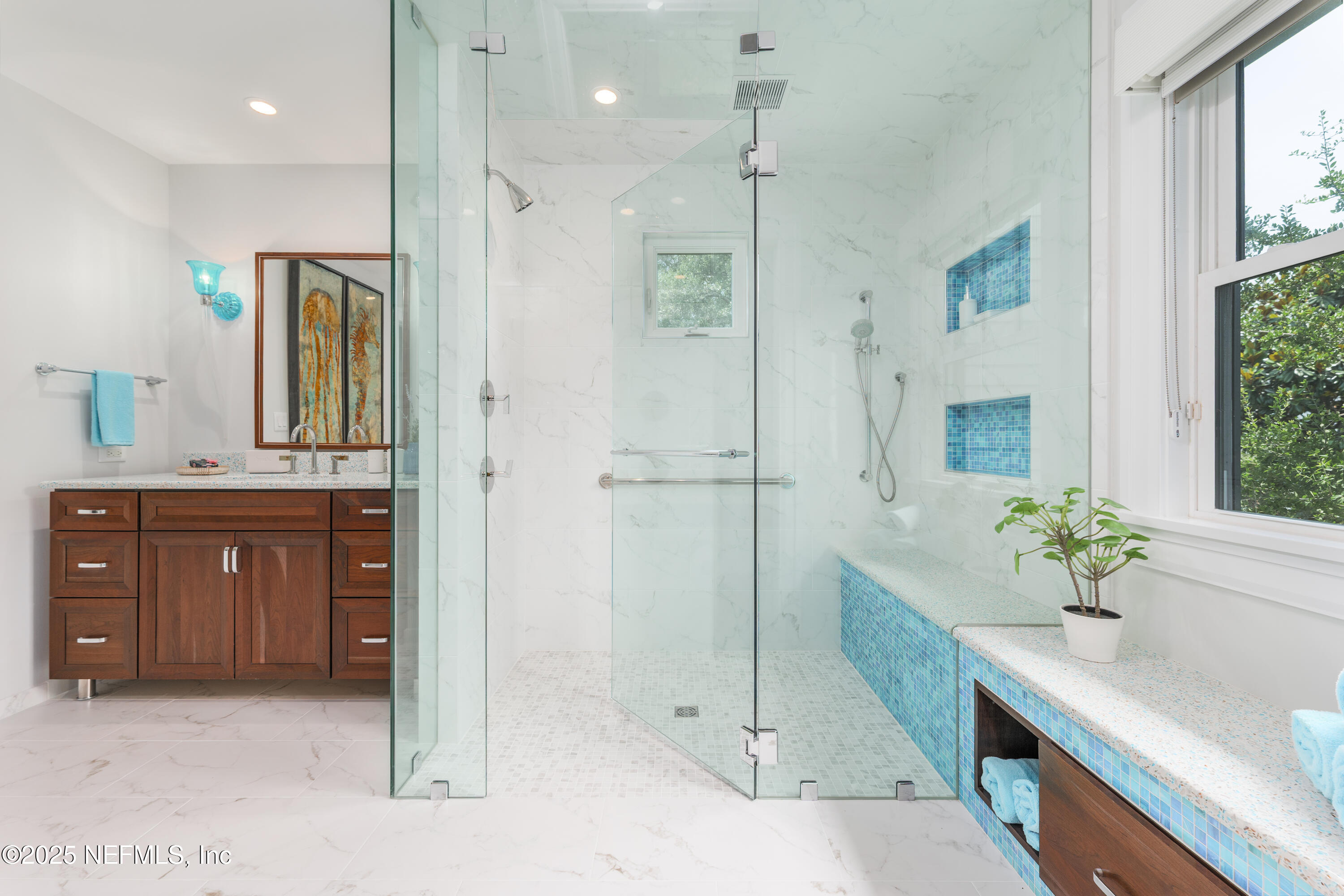 365 8th Street Atlantic Beach, FL 32233 - Photo 33 of 65 a spacious bathroom with a granite countertop sink mirror and a shower