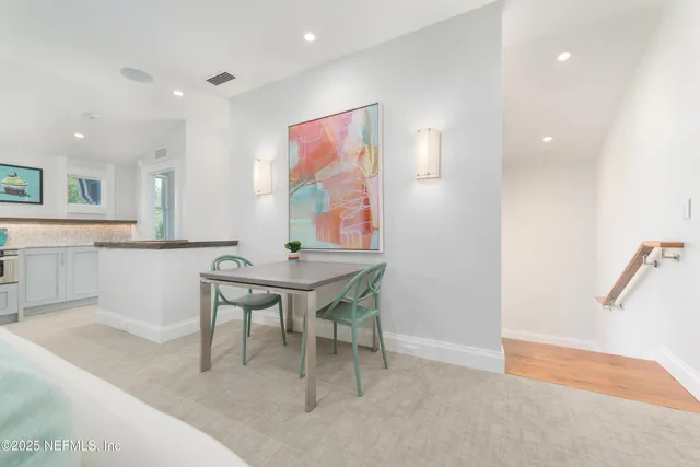 a reading room with furniture wooden floor and a window