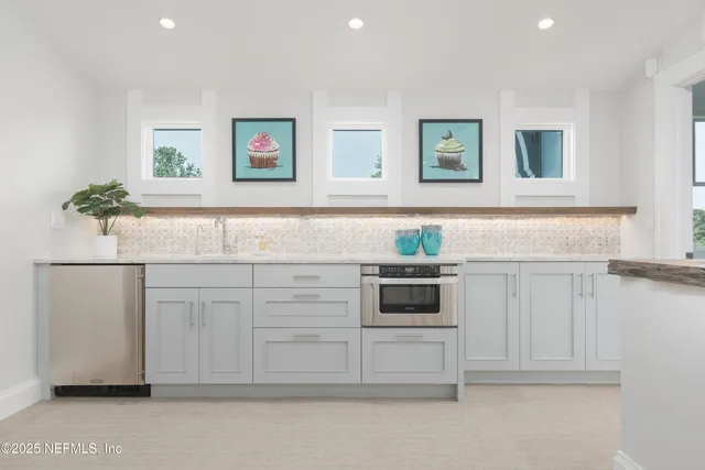 a living room with a rug and a window