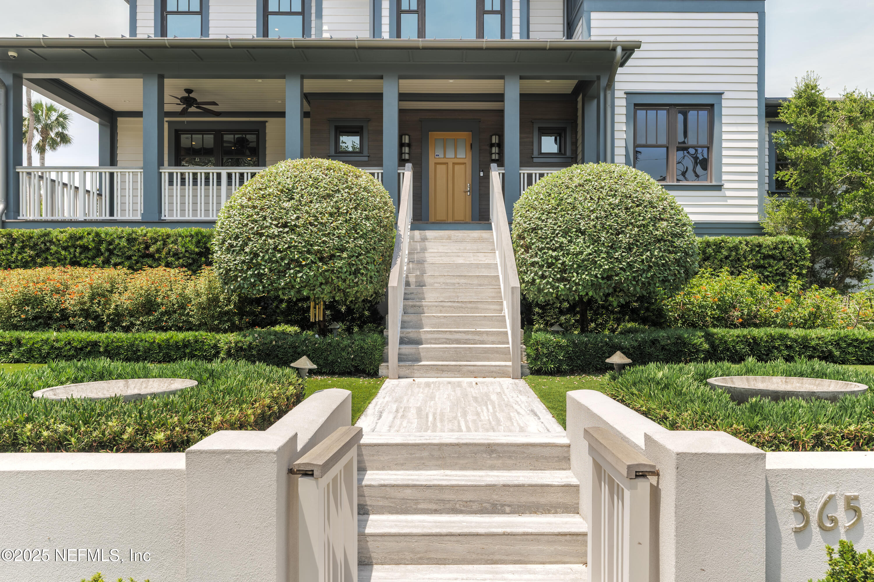 365 8th Street Atlantic Beach, FL 32233 - Photo 4 of 65 a front view of a house with garden