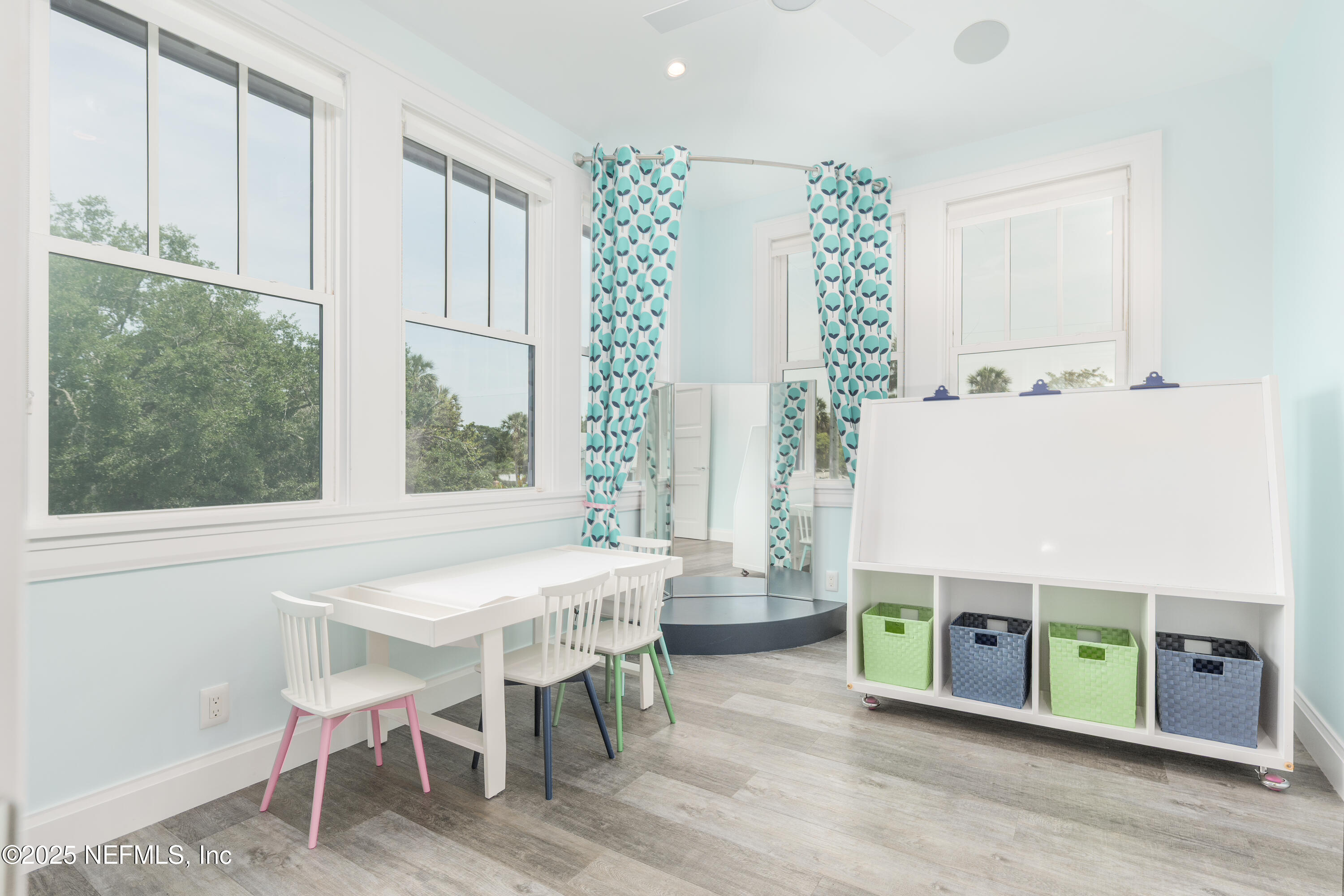 365 8th Street Atlantic Beach, FL 32233 - Photo 41 of 65 a dining room with a table chairs and a kitchen view