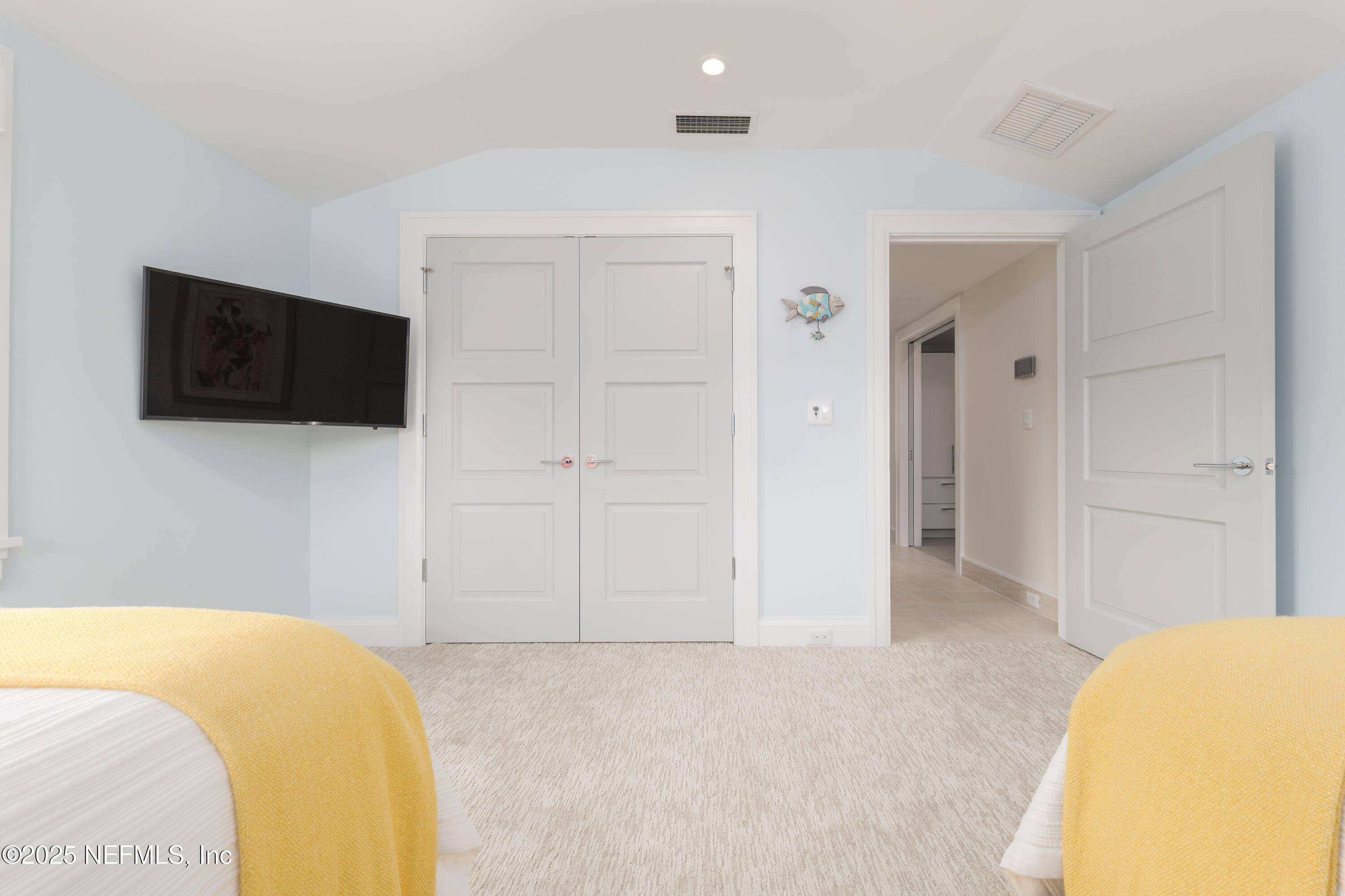 365 8th Street Atlantic Beach, FL 32233 - Photo 43 of 65 a bedroom with a bed and a flat screen tv