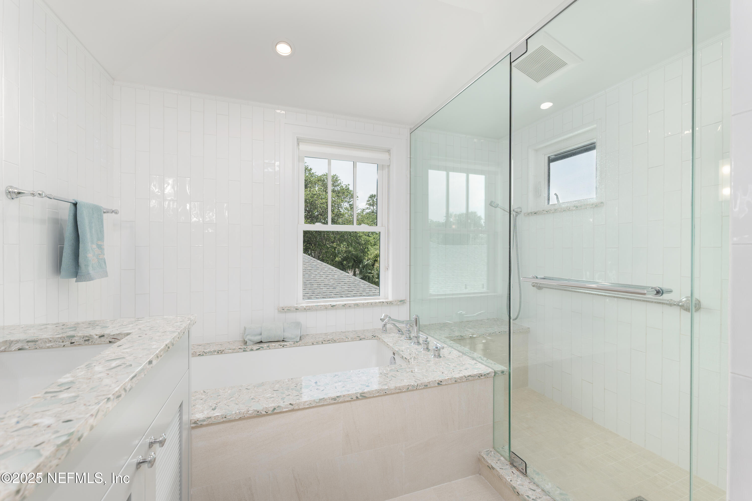 365 8th Street Atlantic Beach, FL 32233 - Photo 45 of 65 a bathroom with a granite countertop sink a mirror and a bathtub