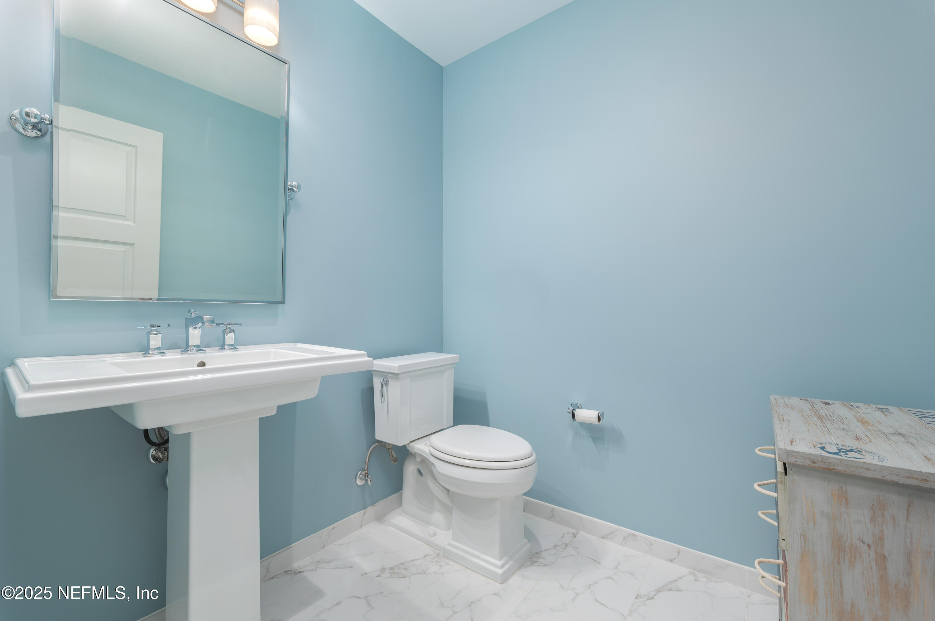 365 8th Street Atlantic Beach, FL 32233 - Photo 52 of 65 a bathroom with a sink toilet and a mirror