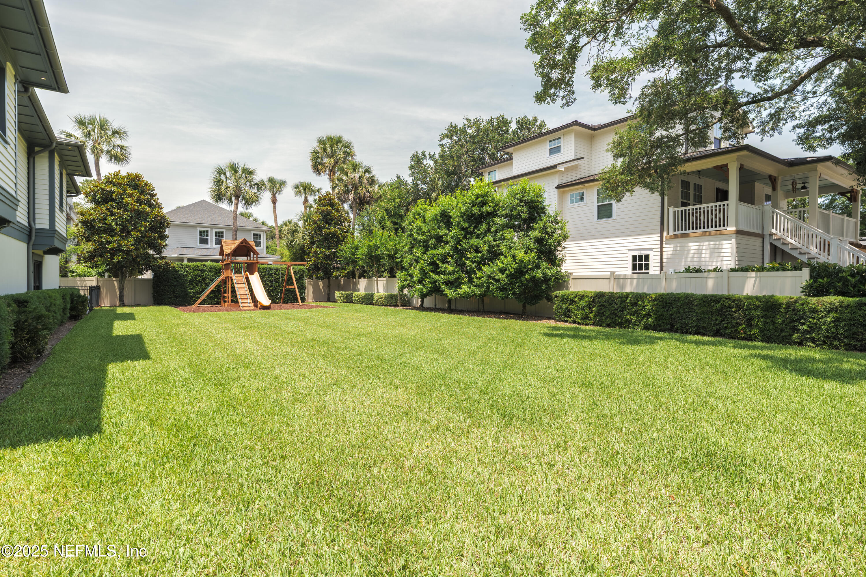 365 8th Street Atlantic Beach, FL 32233 - Photo 61 of 65 a view of a house with a yard and basketball court