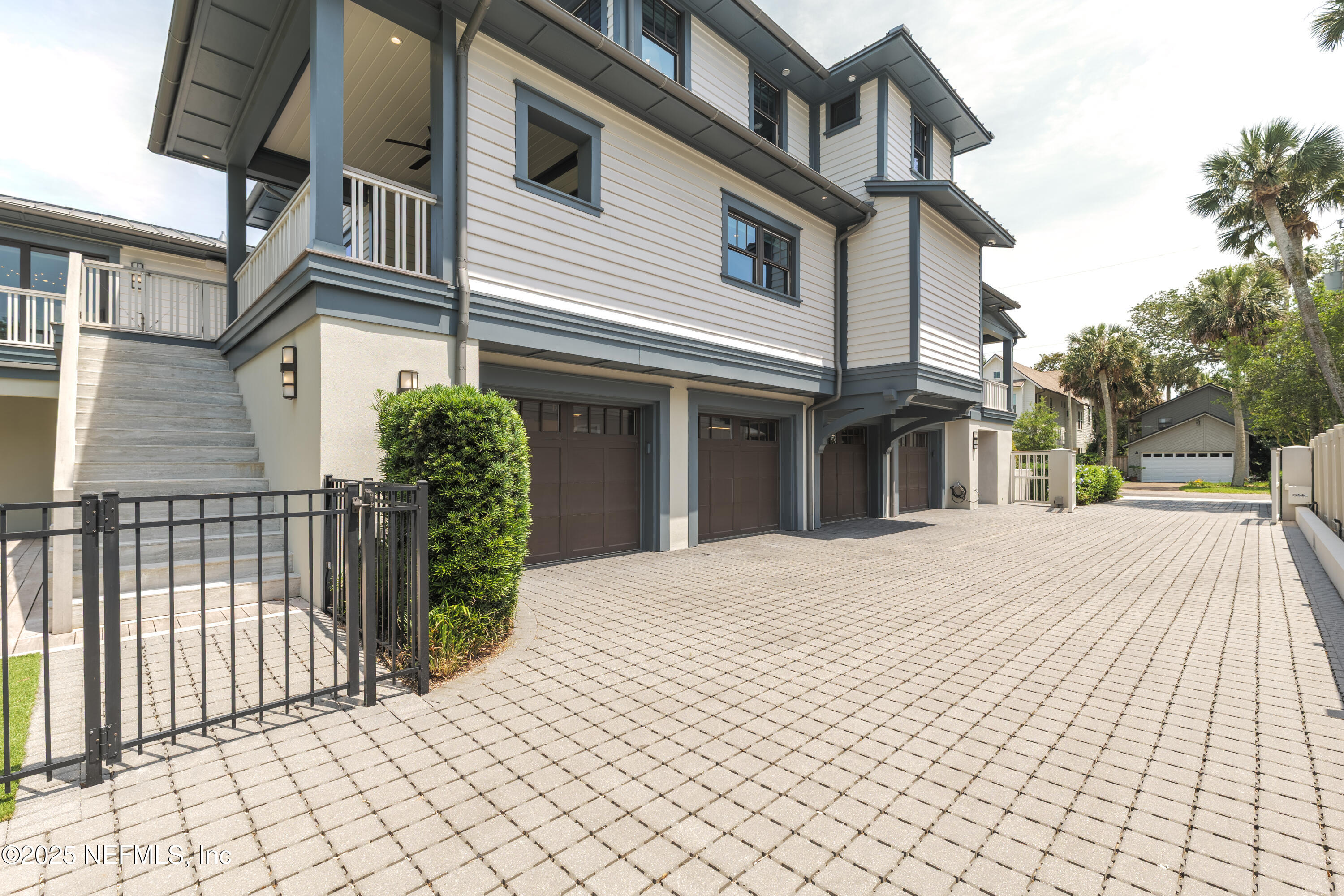 365 8th Street Atlantic Beach, FL 32233 - Photo 63 of 65 a front view of a house with a garage