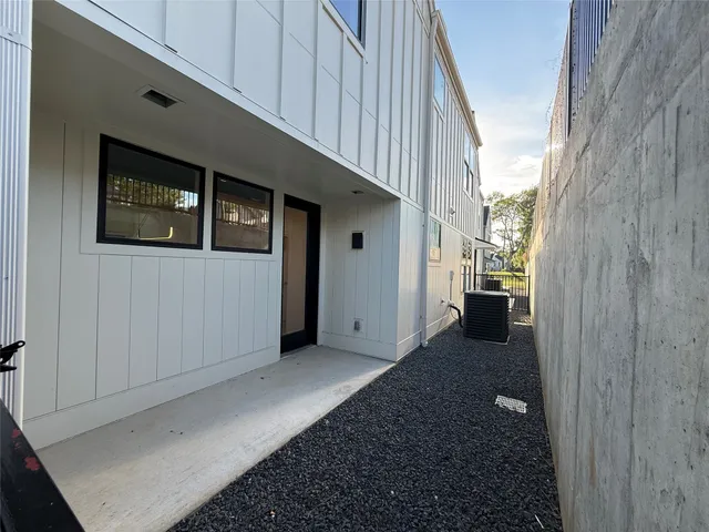a view of a hallway with wooden walls and entryway
