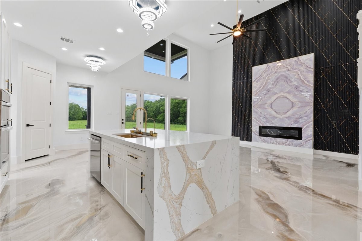 3237 Harkey Road Pearland, TX 77584 - Photo 14 of 46 Oversized waterfall island overlooking the dramatic living space.