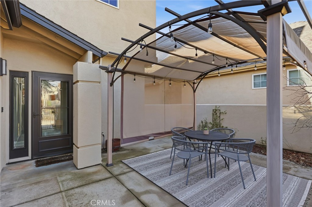 97 Benson Terrace Chico, CA 95928 - Photo 12 of 39 a patio with a table and chairs