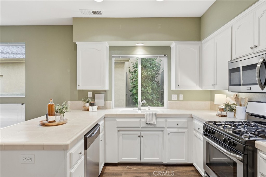 97 Benson Terrace Chico, CA 95928 - Photo 24 of 39 a kitchen with a sink stove and microwave