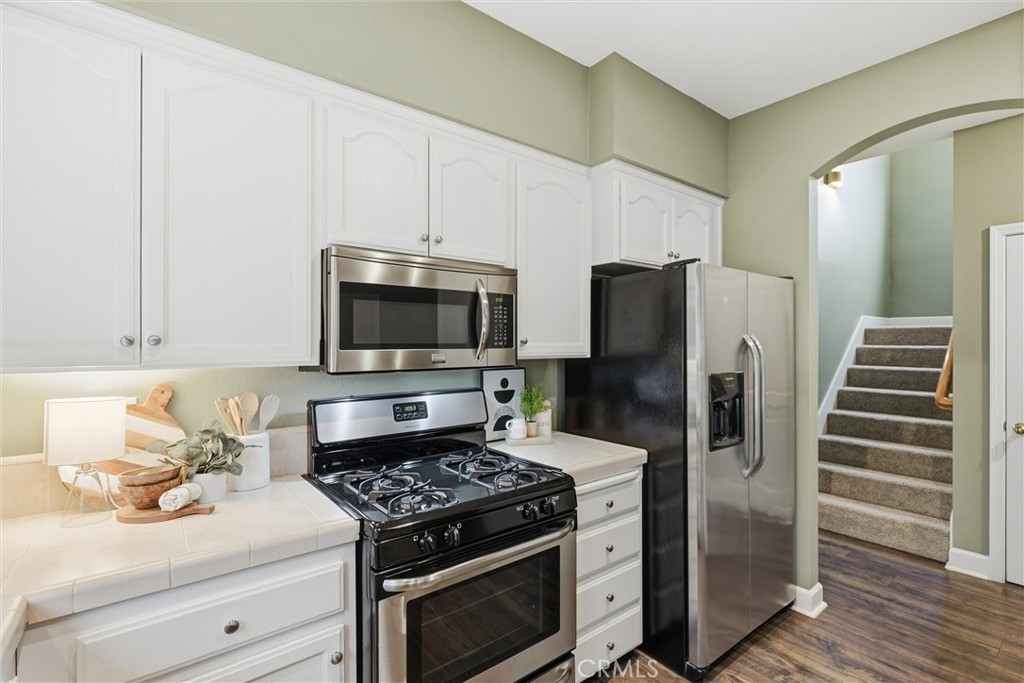 97 Benson Terrace Chico, CA 95928 - Photo 26 of 39 a kitchen with stainless steel appliances a stove a microwave and refrigerator