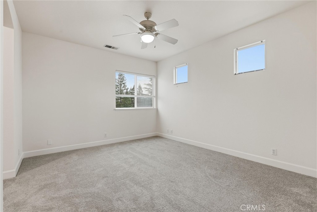 97 Benson Terrace Chico, CA 95928 - Photo 30 of 39 an empty room with windows and fan