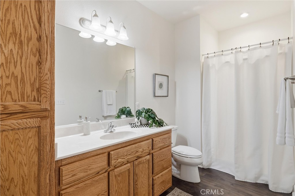 97 Benson Terrace Chico, CA 95928 - Photo 35 of 39 a bathroom with a toilet a sink and a mirror