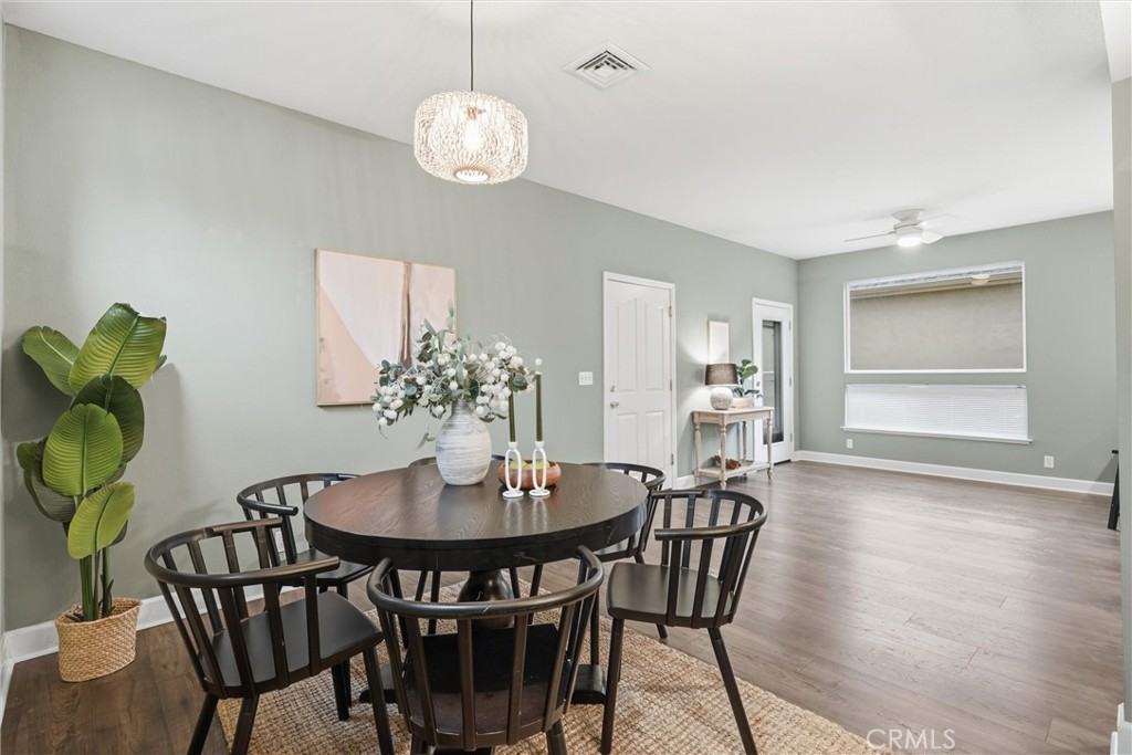 97 Benson Terrace Chico, CA 95928 - Photo 5 of 39 a view of a dining room with furniture and wooden floor