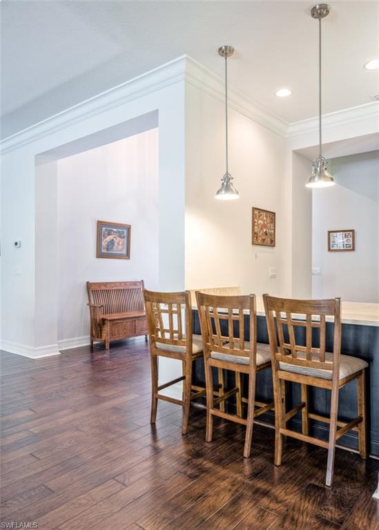 Undisclosed Address Naples, FL 34119 - Photo 13 of 32 a view of kitchen with dining room and wooden floor