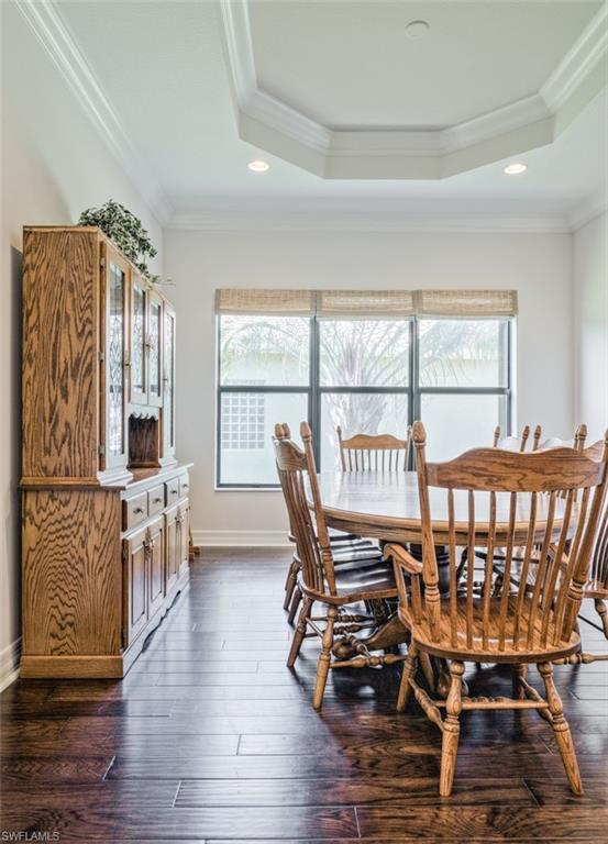 Undisclosed Address Naples, FL 34119 - Photo 16 of 32 a dining room with furniture window and wooden floor