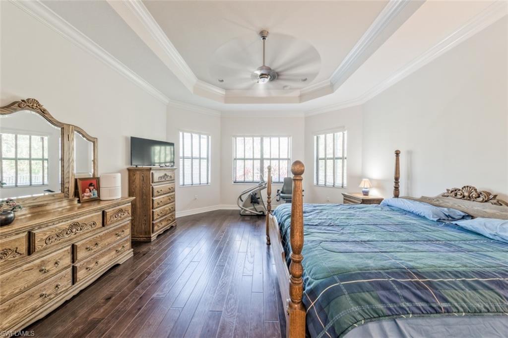 Undisclosed Address Naples, FL 34119 - Photo 17 of 32 a bed room with furniture and a flat screen tv