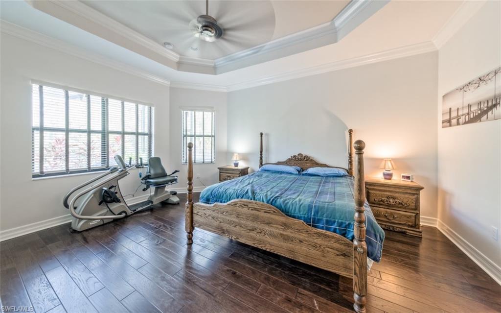 Undisclosed Address Naples, FL 34119 - Photo 18 of 32 a bedroom with furniture and wooden floor