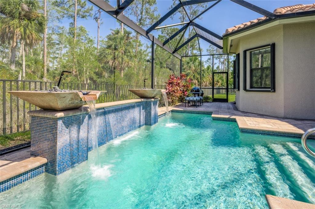 Undisclosed Address Naples, FL 34119 - Photo 2 of 32 a view of a backyard with plants and a patio