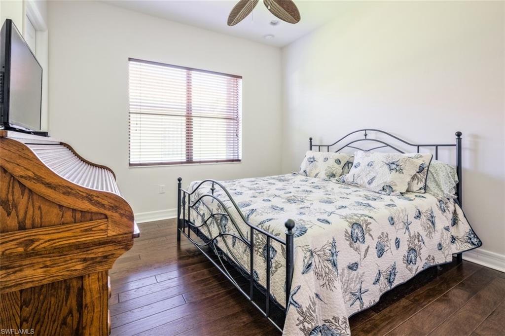 Undisclosed Address Naples, FL 34119 - Photo 22 of 32 a bedroom with a bed and a window