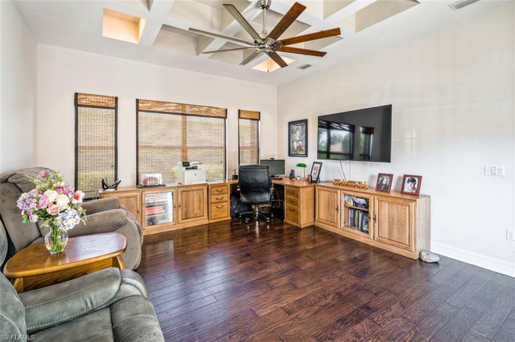 Undisclosed Address Naples, FL 34119 - Photo 25 of 32 a living room with furniture and a flat screen tv