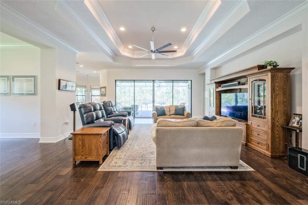 Undisclosed Address Naples, FL 34119 - Photo 8 of 32 a living room with furniture and a large window