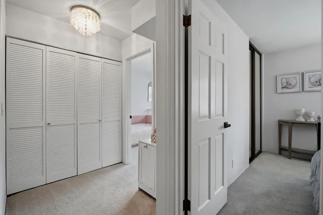 a view of a hallway with closet area
