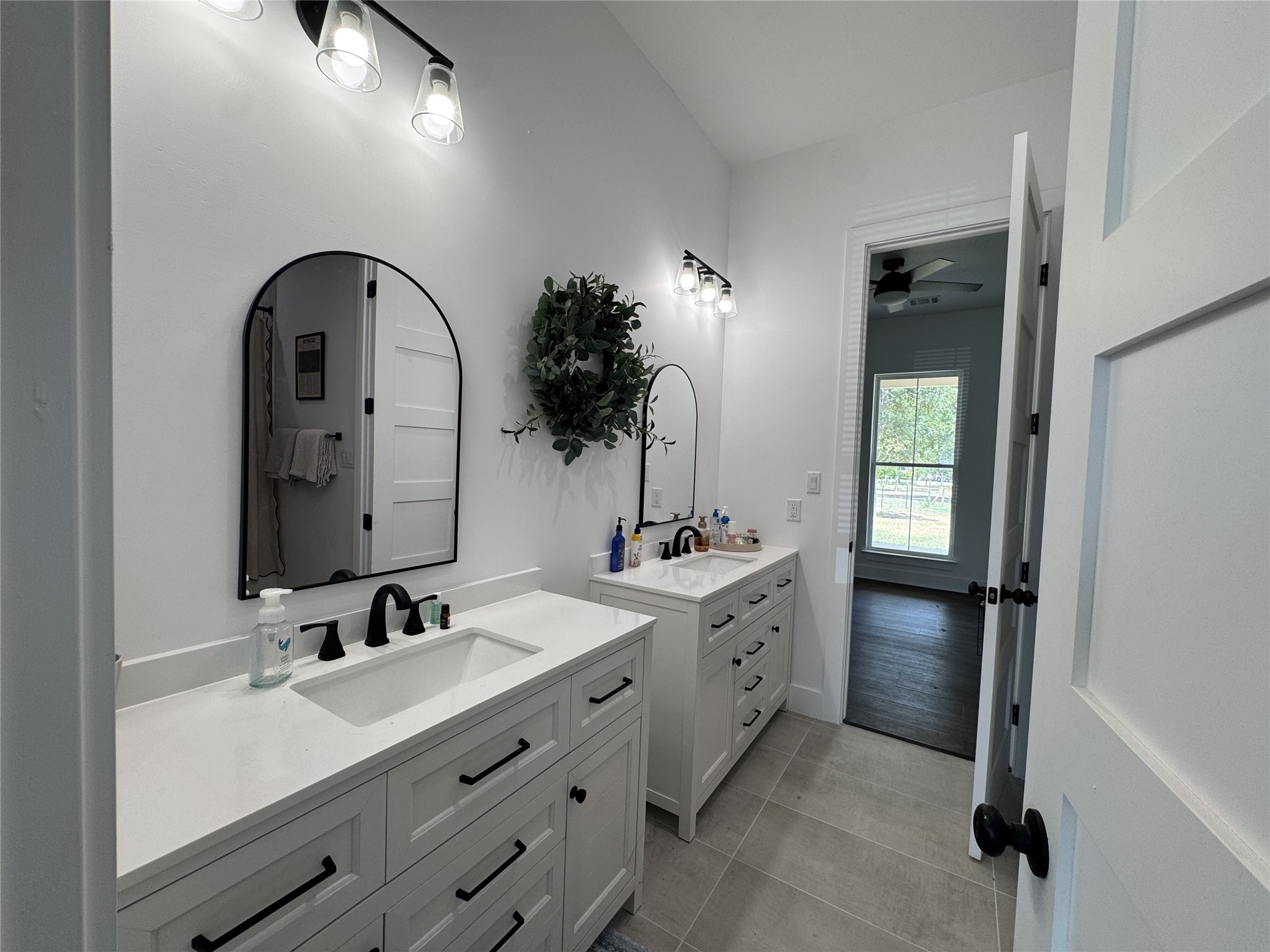 1353 Red Town Road, Unit B Elgin, TX 78621 - Photo 22 of 26 Clean lines and a spacious dual vanity define this modern bathroom design.
