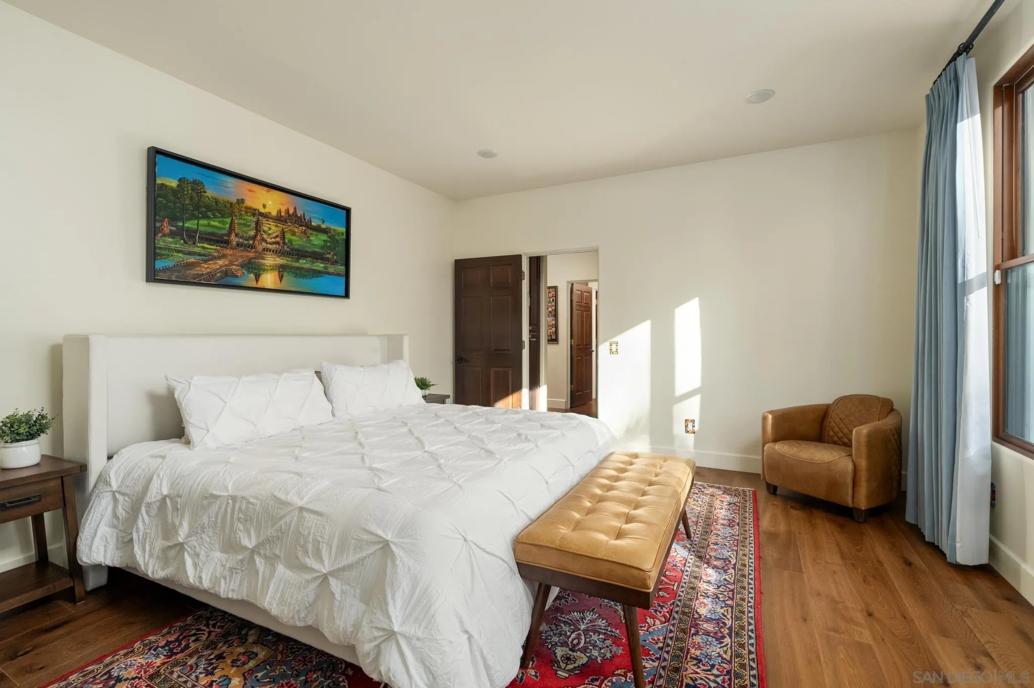 3028 Paseo Cielo Rancho Santa Fe, CA 92024 - Photo 24 of 50 a bedroom with a bed and wooden floor