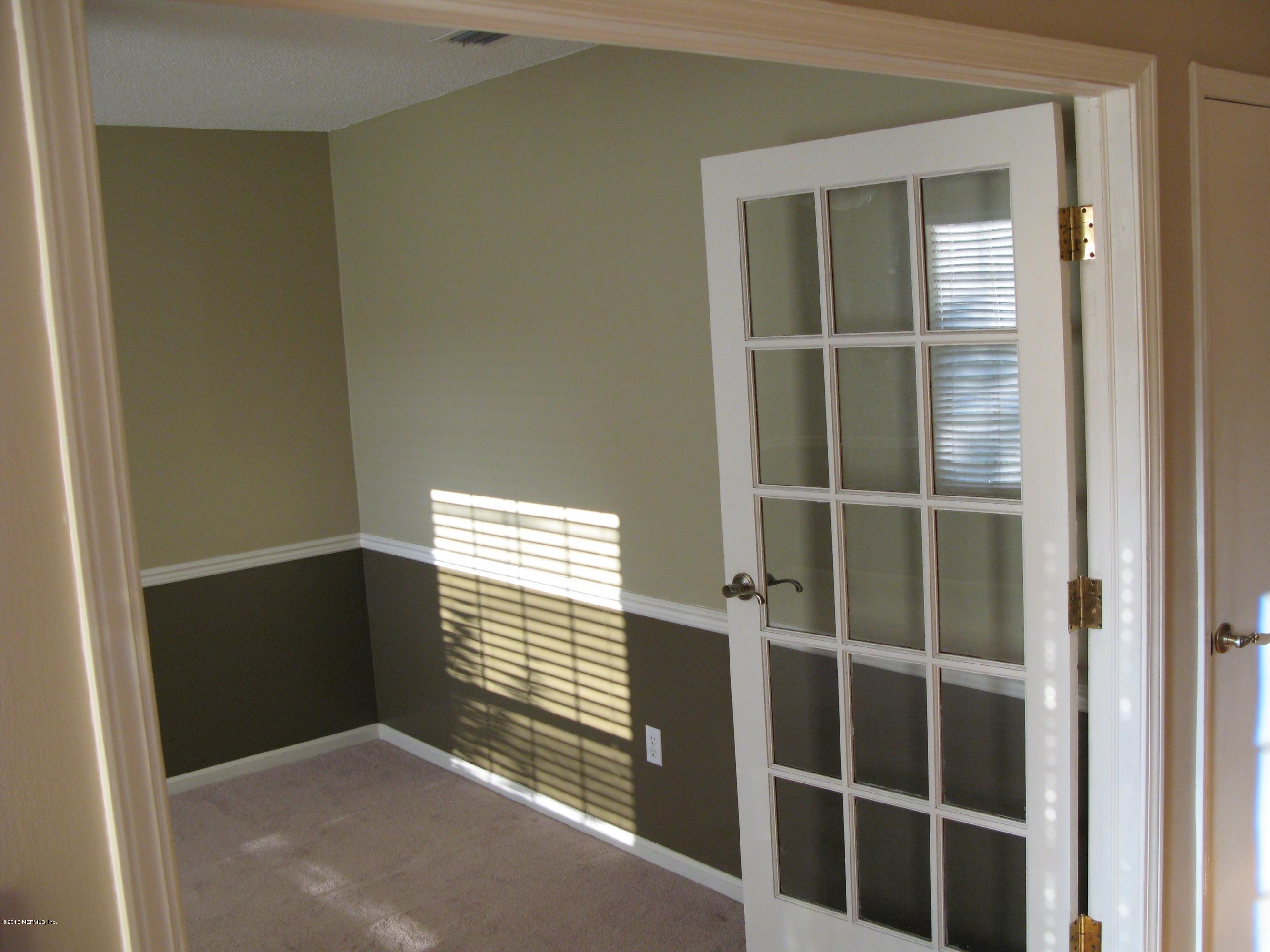 11060 Reading Road Jacksonville, FL 32257 - Photo 8 of 31 a view of an empty room with a window