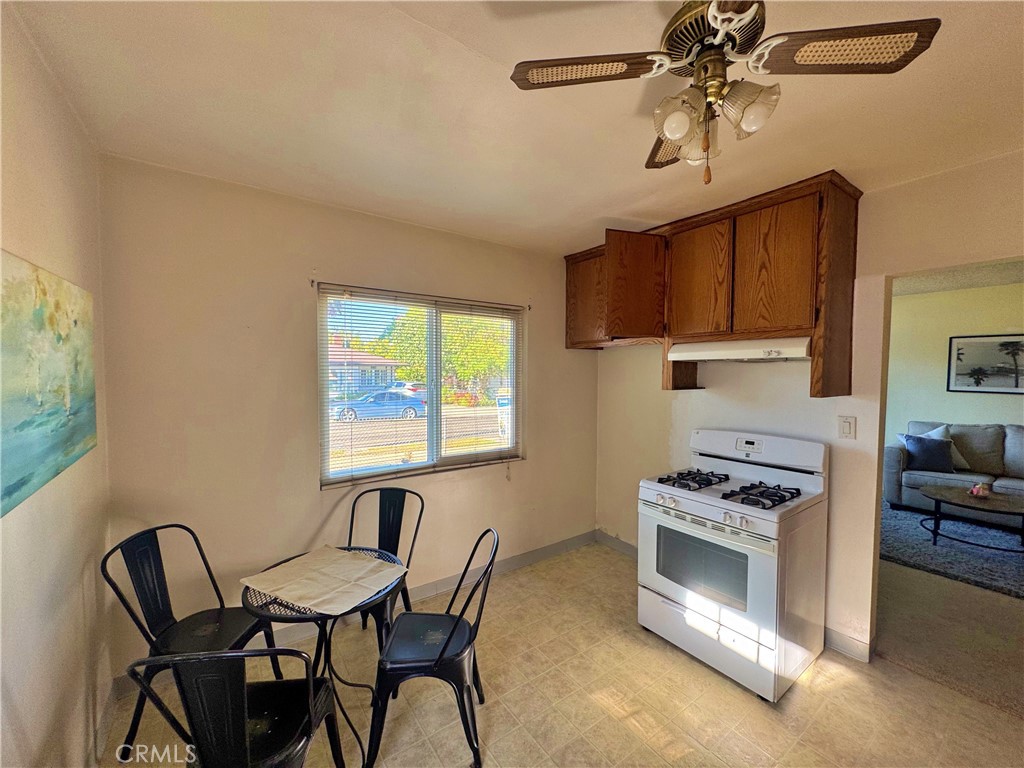1852 260th Street Lomita, CA 90717 - Photo 17 of 63 a kitchen with stainless steel appliances a stove a sink cabinets and a window