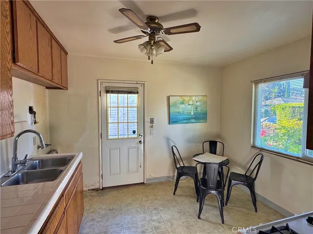 a bathroom with a white bath tub a toilet and a sink