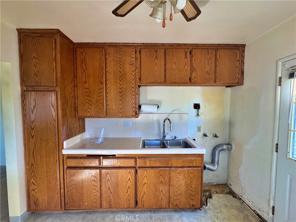 1852 260th Street Lomita, CA 90717 - Photo 20 of 63 a bathroom with a sink a mirror and cabinets