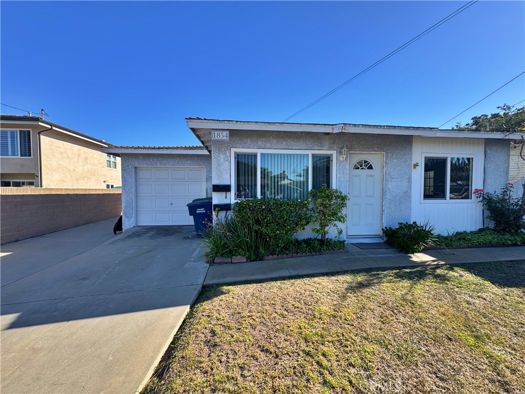 1852 260th Street Lomita, CA 90717 - Photo 3 of 63 a front view of a house with garden