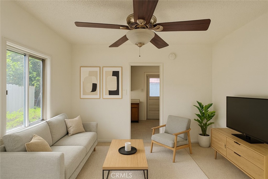 1852 260th Street Lomita, CA 90717 - Photo 43 of 63 a living room with furniture and a flat screen tv