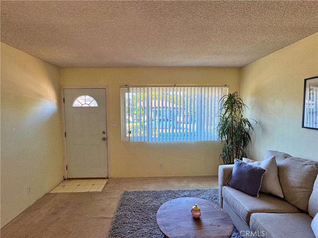1852 260th Street Lomita, CA 90717 - Photo 8 of 63 a living room with furniture and a rug