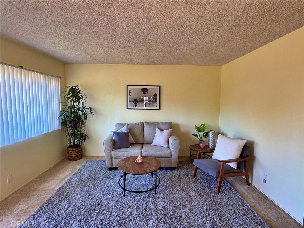 1852 260th Street Lomita, CA 90717 - Photo 9 of 63 a living room with furniture and a potted plant